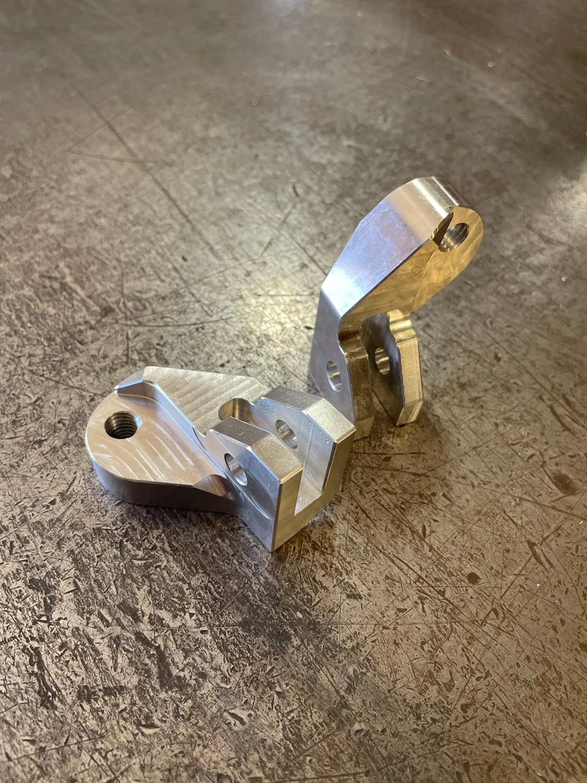 Archived M8 offset mounting brackets; reference photograph, not the complete polished peg set